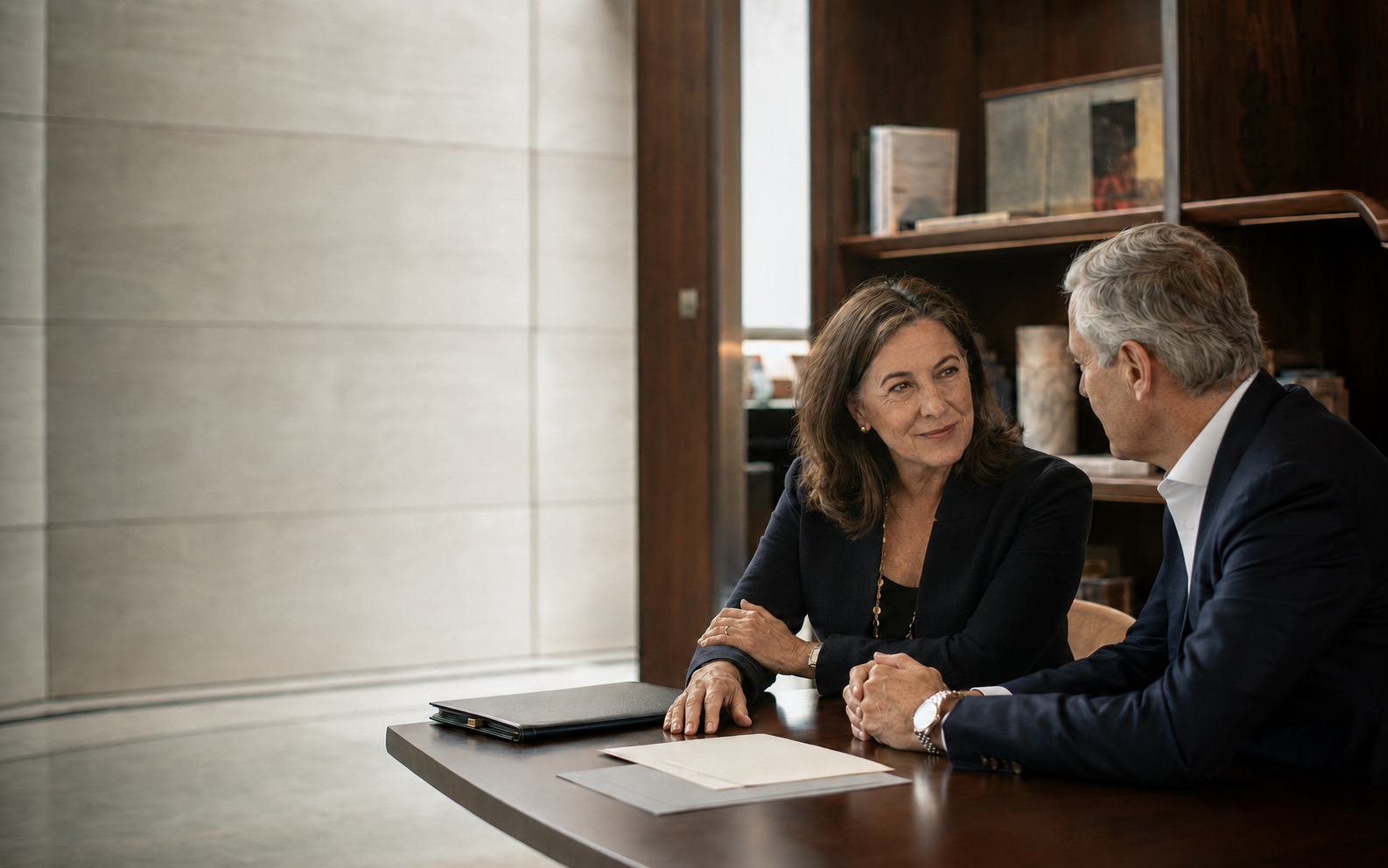 Two nonprofit leaders in a focused fundraising conversation